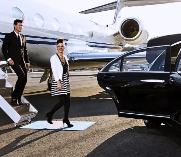 Passengers boarding car from private jet