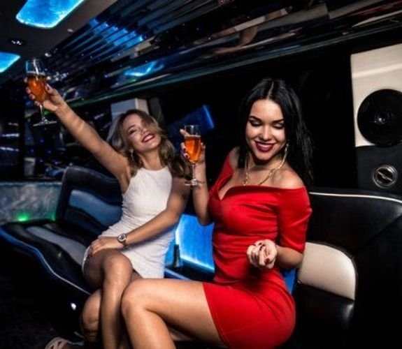 Young girls parting in a limo