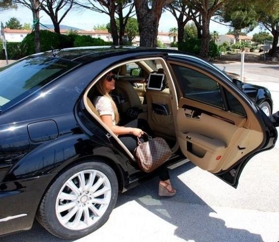 business women stepping outside a car business women stepping outside a car